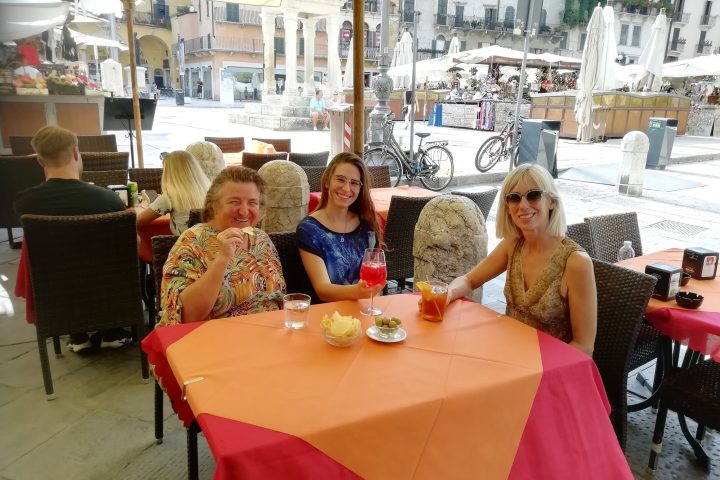 a group of people sitting at a table in a restaurant
